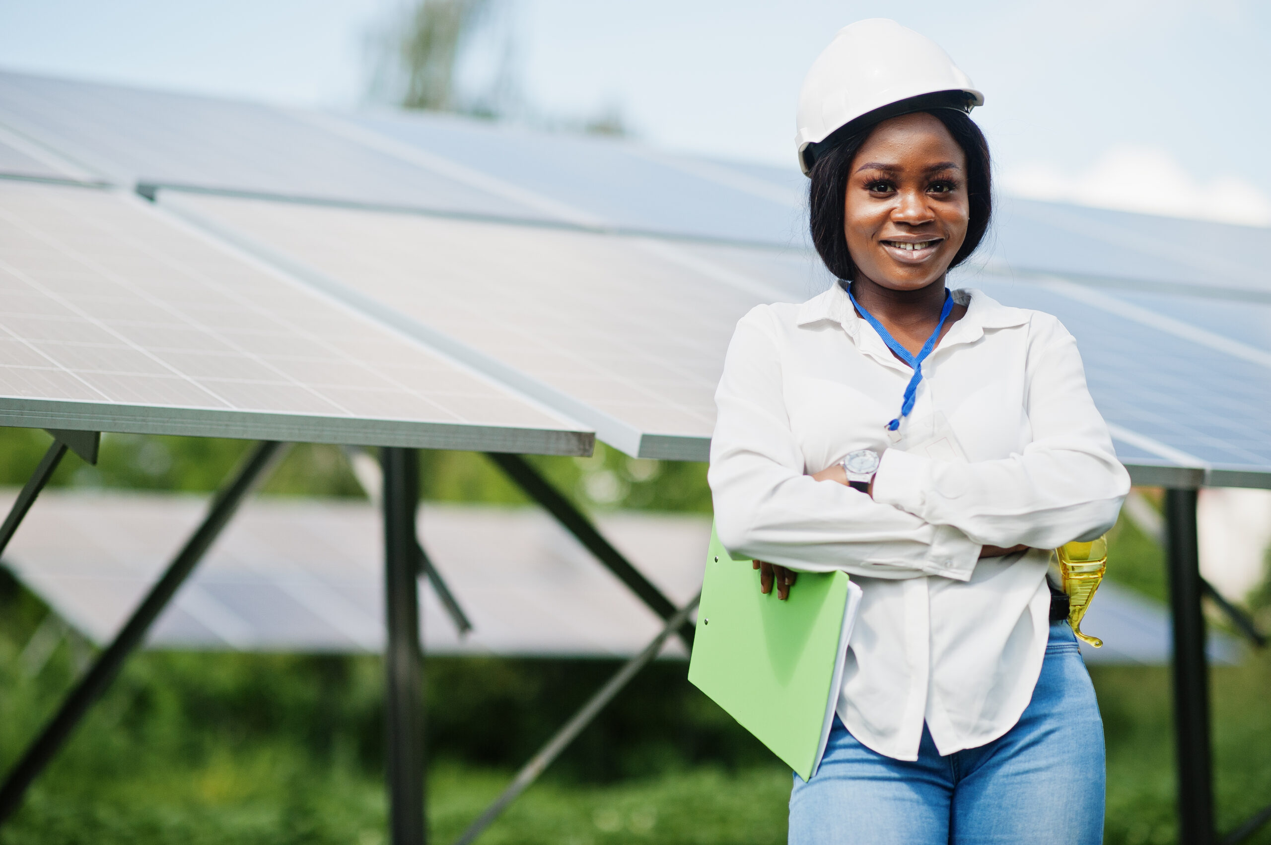 African american technician check the maintenance of the solar panels. Black woman engineer at solar station.
